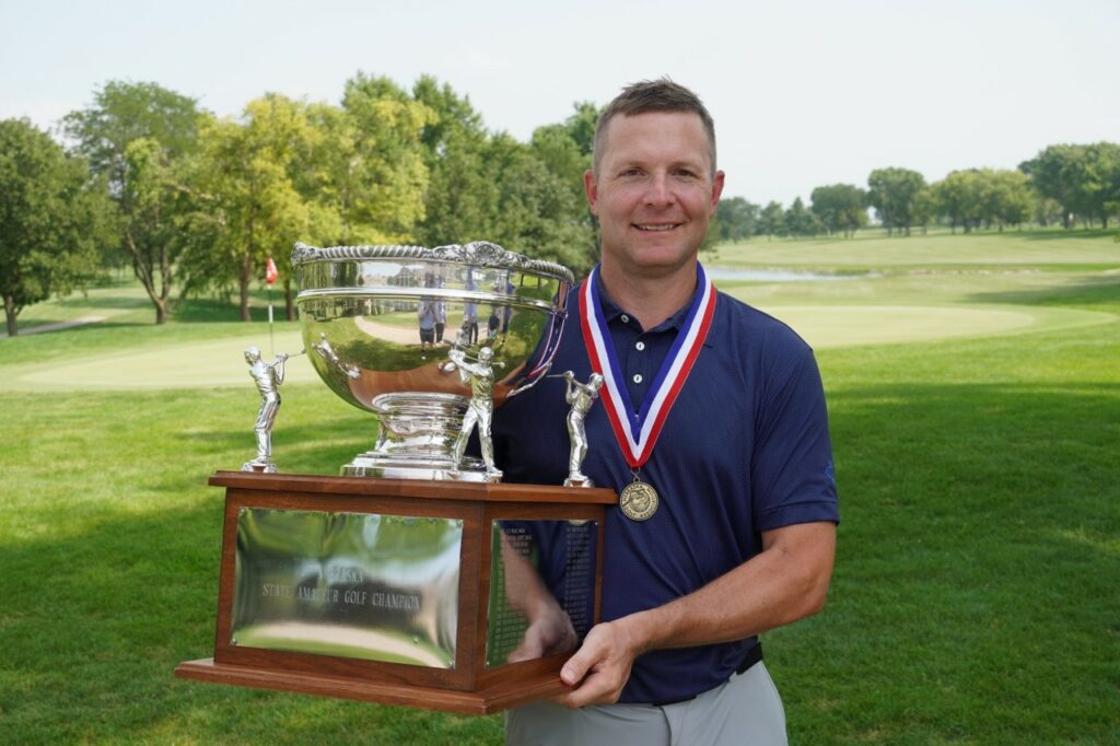 David Easley holds the Nebraska Amateur Championship trophy.
